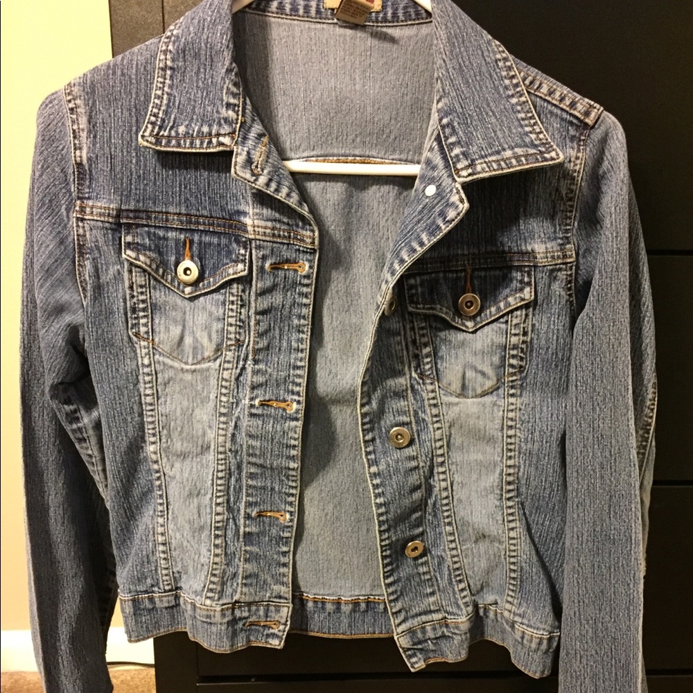 Denim jacket with distressed detail on elbows